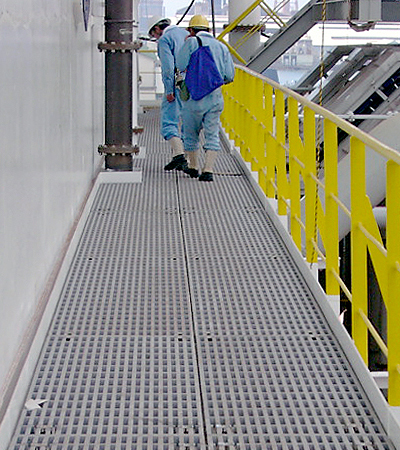 Workers on Gray Superspan Rectangular Mesh Molded Grating Walkway